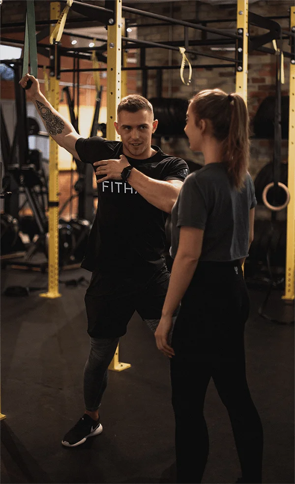 Coach reviewing a program with a client